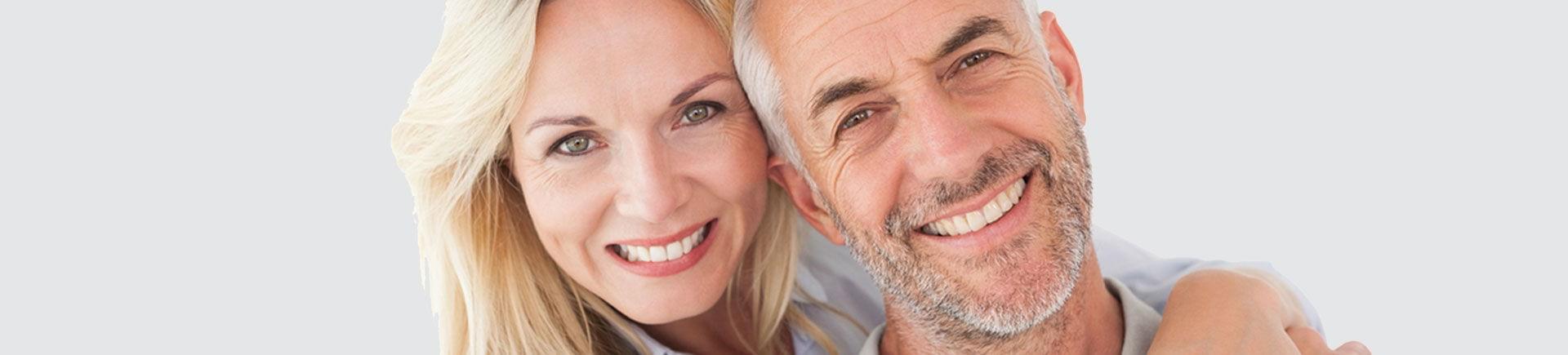 Happy mature couple with perfect smiles.